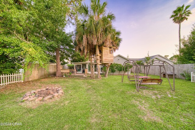 yard at dusk with a deck