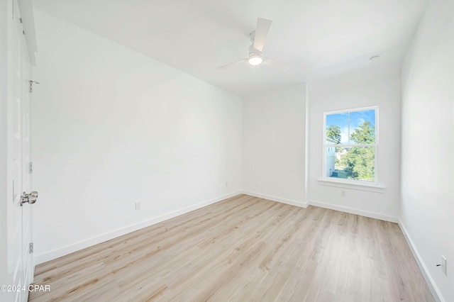 spare room with ceiling fan and light hardwood / wood-style flooring