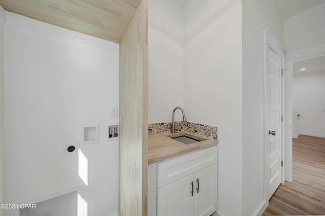 bathroom featuring sink and hardwood / wood-style floors