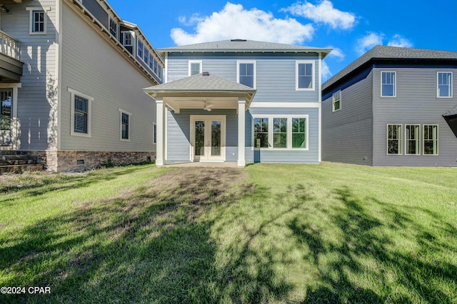 back of house with a yard, ceiling fan, and french doors