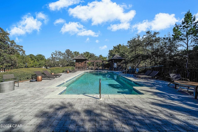 view of pool with a gazebo and a patio