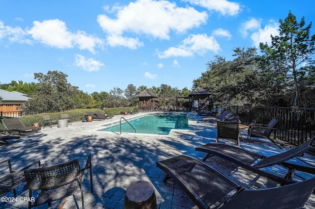 view of pool with a gazebo and a patio