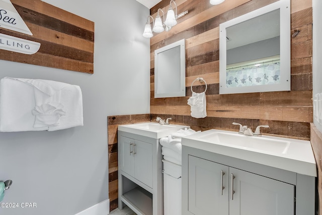 full bathroom with vanity and wooden walls