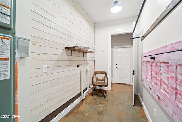 interior space featuring wood walls