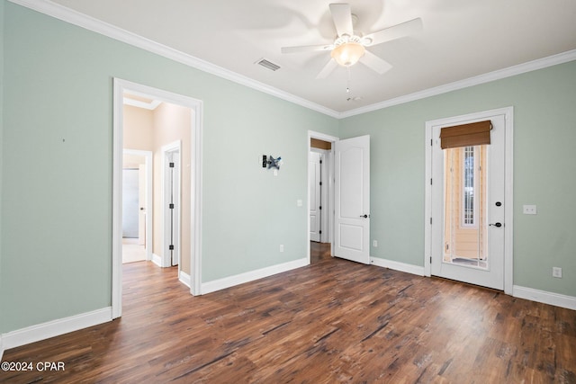 unfurnished bedroom featuring crown molding, dark wood-type flooring, and ceiling fan