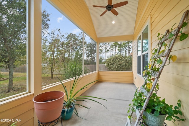 sunroom featuring ceiling fan and lofted ceiling