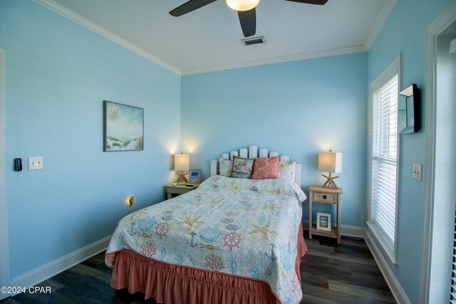 bedroom featuring ceiling fan, crown molding, and dark wood-type flooring