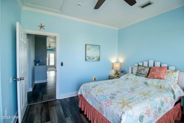 bedroom featuring ceiling fan, crown molding, and dark wood-type flooring