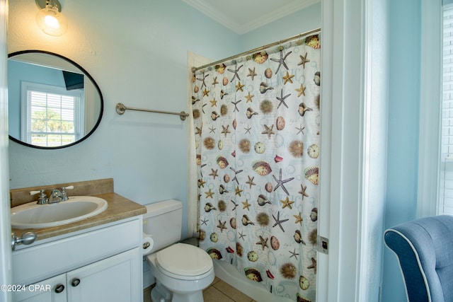 bathroom featuring tile patterned flooring, crown molding, vanity, and toilet