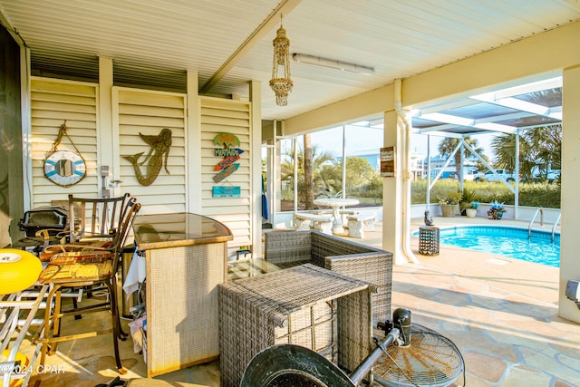 view of patio / terrace featuring glass enclosure