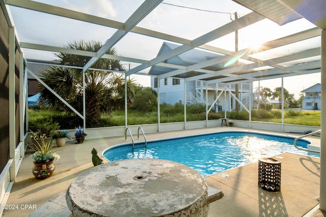 pool featuring a lanai and a patio