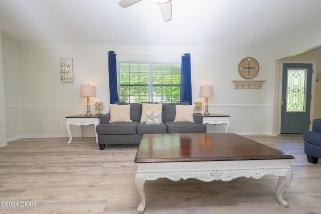 living room with light wood-type flooring and ceiling fan