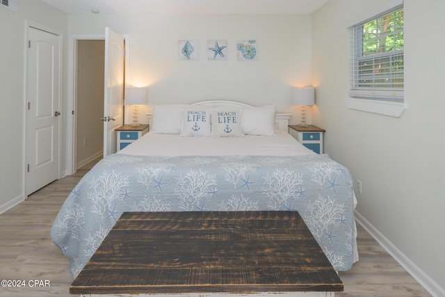 bedroom with light wood-type flooring