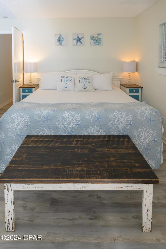 bedroom with hardwood / wood-style floors