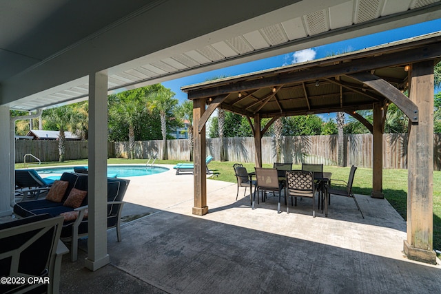 view of patio / terrace featuring a gazebo and a fenced in pool