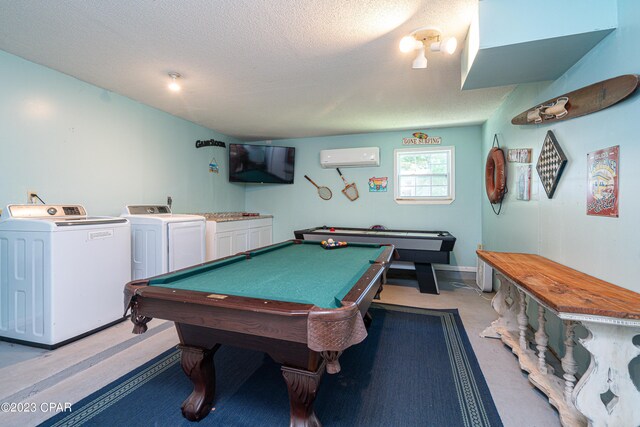 rec room with washer and dryer, a textured ceiling, pool table, and a wall unit AC