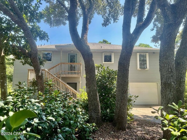 back of house featuring a garage