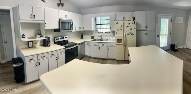 kitchen with sink, light hardwood / wood-style flooring, stainless steel appliances, and white cabinets