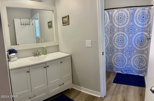 bathroom featuring vanity and hardwood / wood-style floors