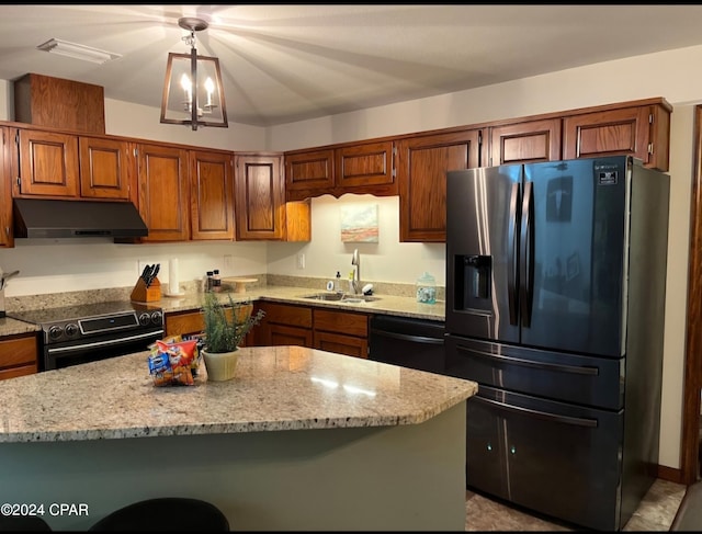 kitchen with an inviting chandelier, a center island, black appliances, and sink