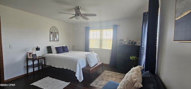 bedroom with dark wood-type flooring and ceiling fan