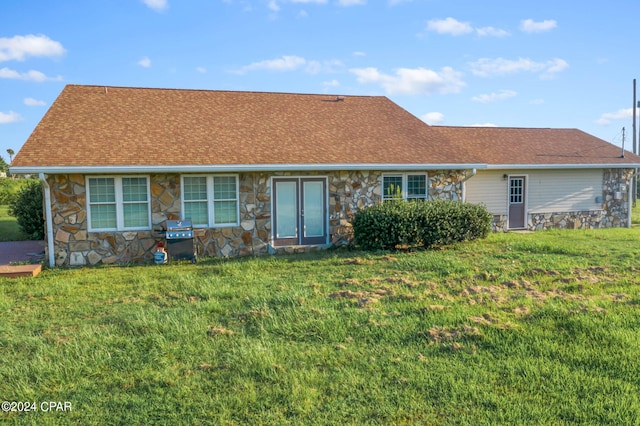 ranch-style house with a front yard