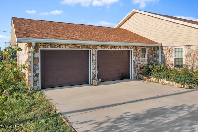 single story home with a garage