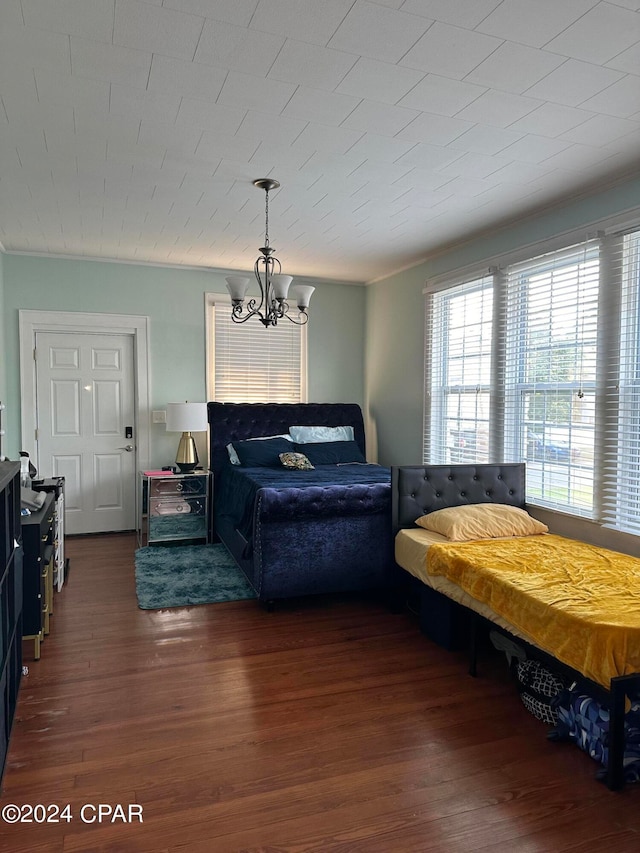 living room featuring hardwood / wood-style floors and a notable chandelier