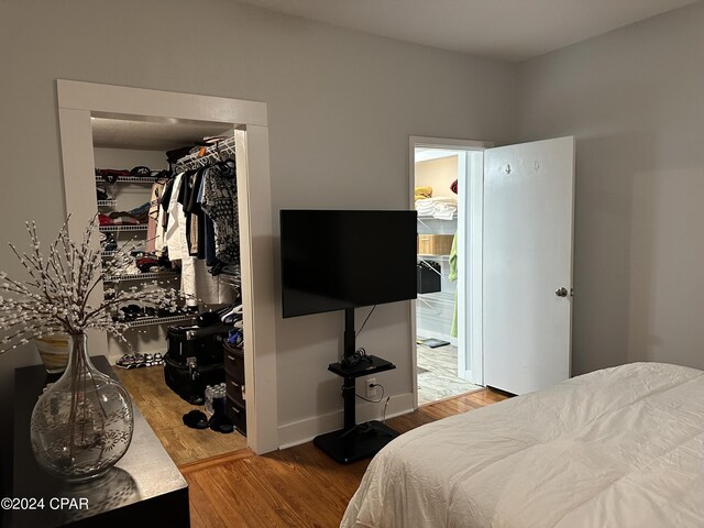 bedroom featuring a closet and hardwood / wood-style floors