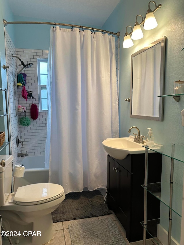 full bathroom with tile patterned floors, vanity, shower / tub combo with curtain, and toilet