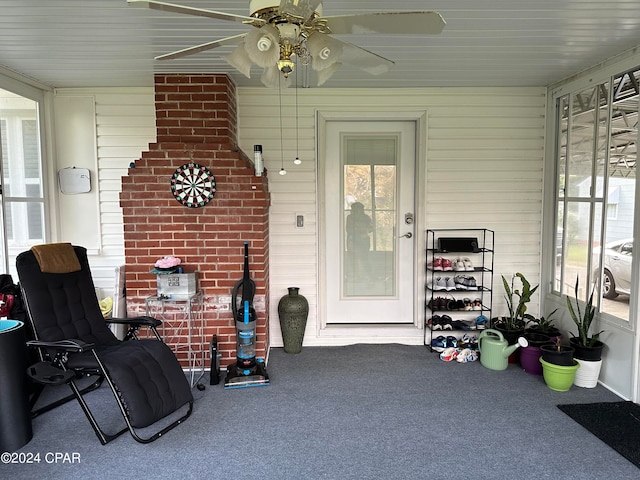 doorway to property with ceiling fan