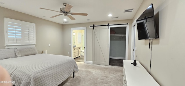 bathroom featuring toilet, vanity, and hardwood / wood-style flooring