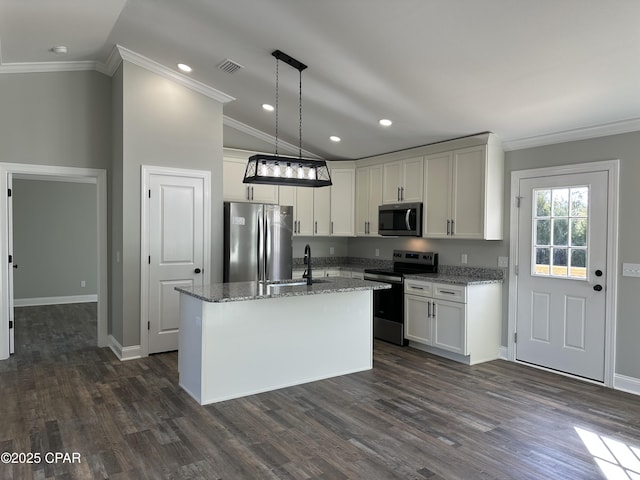 kitchen with sink, white cabinetry, a kitchen island with sink, light stone countertops, and appliances with stainless steel finishes