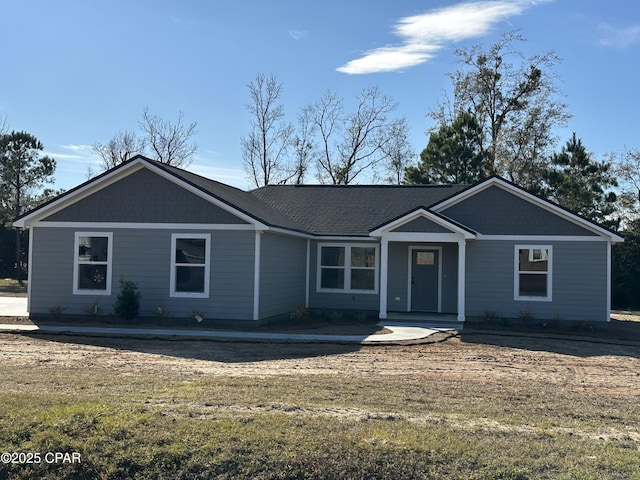 single story home with a front lawn