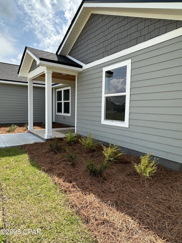 view of side of home with a patio