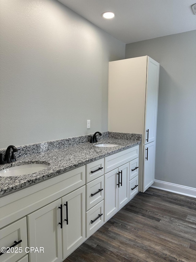 bathroom with wood-type flooring and vanity