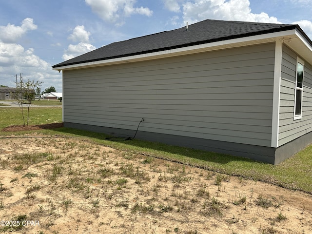 view of property exterior with roof with shingles