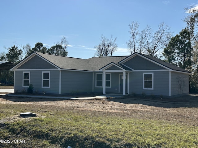 single story home featuring a front yard