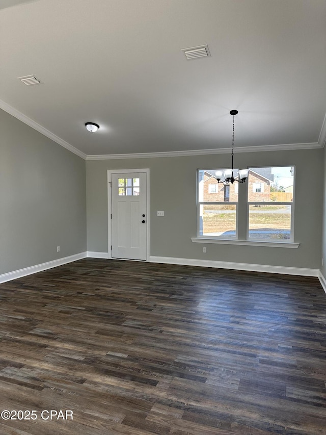 interior space featuring crown molding, a chandelier, and baseboards