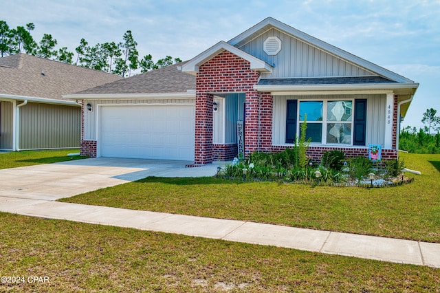 view of front facade with a garage and a front yard