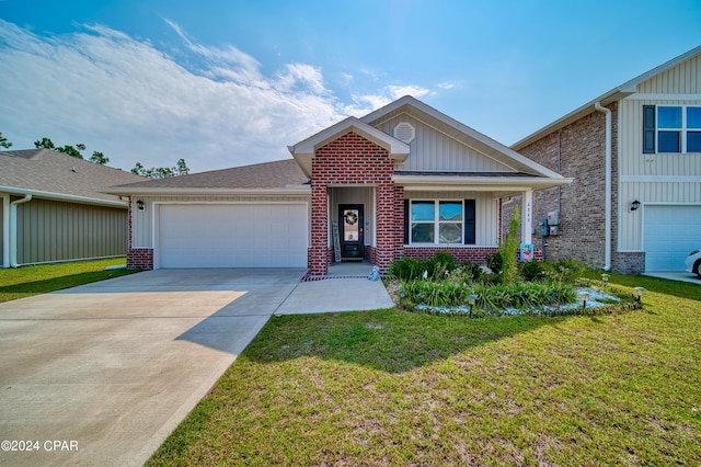 view of front of home with a front yard and a garage