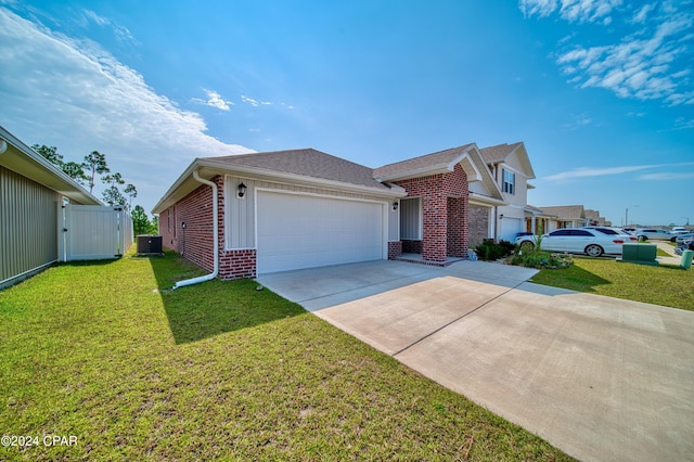 single story home with a garage and a front lawn