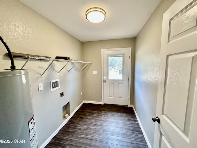 washroom featuring dark hardwood / wood-style floors, hookup for an electric dryer, hookup for a washing machine, and water heater