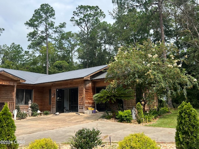 view of front of house featuring solar panels