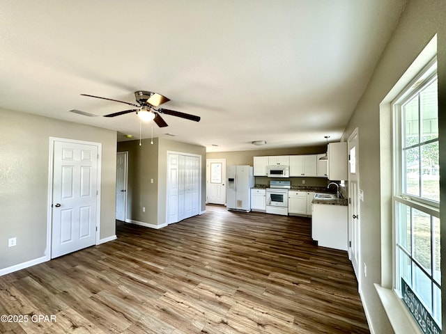 kitchen with wood-type flooring, sink, white cabinets, ceiling fan, and white appliances