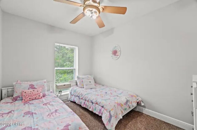 bedroom with ceiling fan and carpet