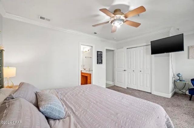 bedroom featuring ceiling fan, carpet flooring, ensuite bathroom, and crown molding