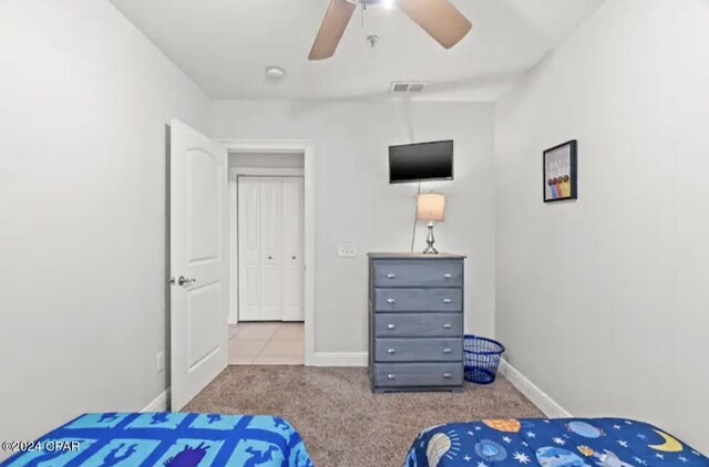 bedroom featuring ceiling fan and light colored carpet