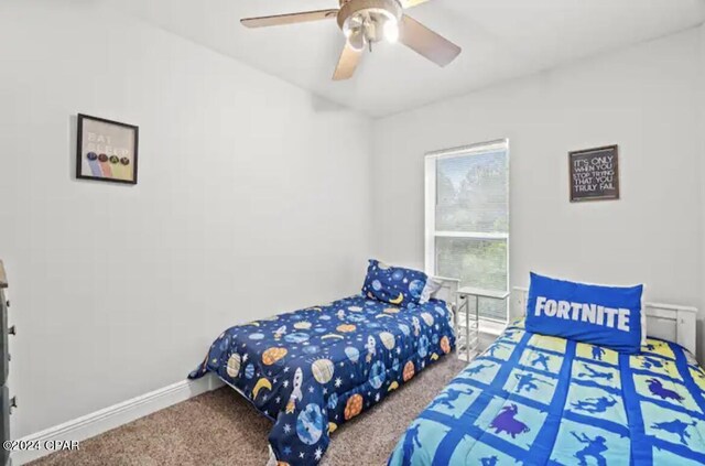 carpeted bedroom with ceiling fan