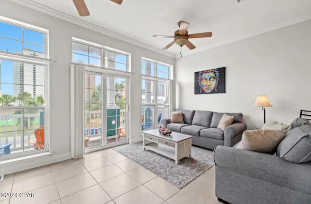 living room featuring ceiling fan, light tile patterned flooring, and ornamental molding